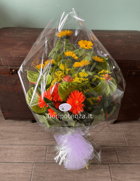 Mazzo funebre con fiori misti di stagione a scelta del fiorista